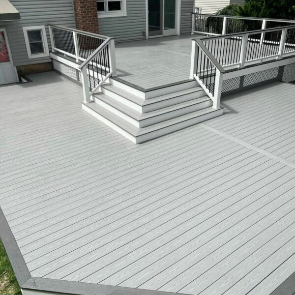 backyard composite deck with picture framing and custom layout